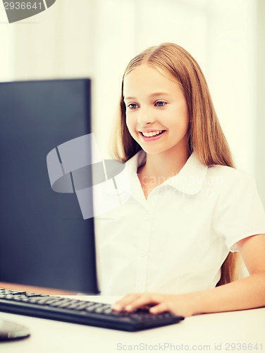 Image of student girl with computer at school