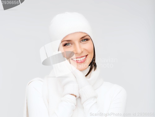 Image of woman in hat, muffler and gloves