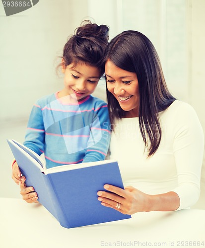 Image of mother and daughter with book