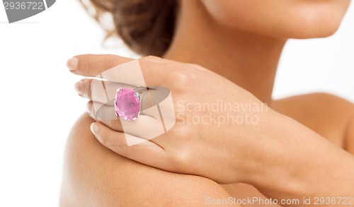 Image of beautiful woman with big pink cocktail ring