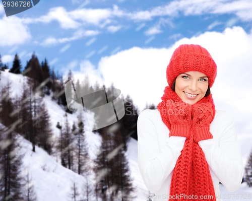 Image of smiling young woman in winter clothes