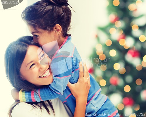 Image of hugging mother and daughter