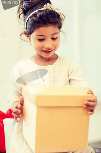 Image of happy child girl with gift box