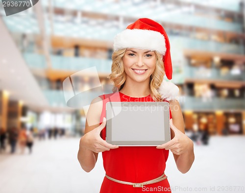 Image of woman in santa helper hat with tablet pc