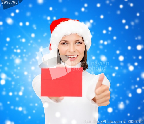 Image of woman in santa helper hat with blank red card