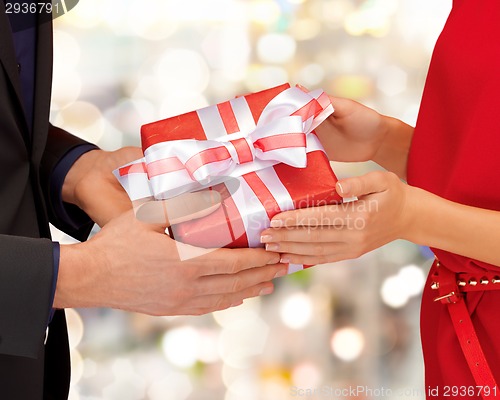 Image of close up of man and woman with present