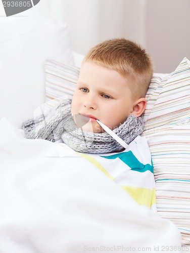 Image of ill boy with flu at home