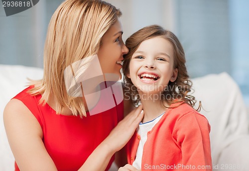 Image of mother and daughter cuddling