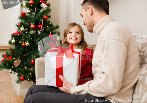 Image of smiling father and daughter looking at each other