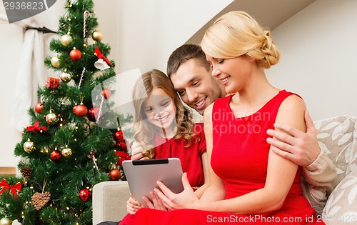 Image of smiling family with tablet pc