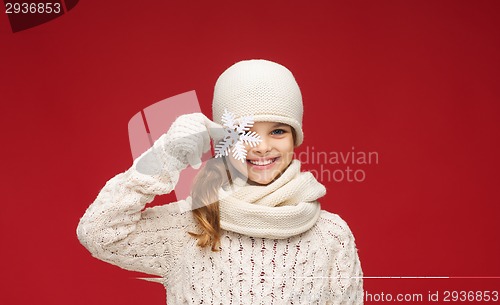 Image of girl with big snowflake