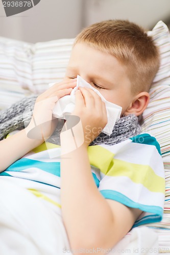 Image of ill boy with flu at home