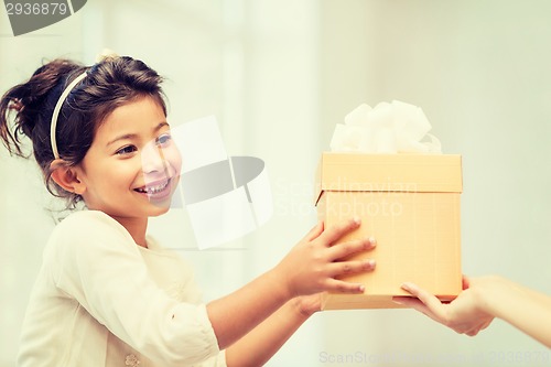 Image of happy child girl with gift box