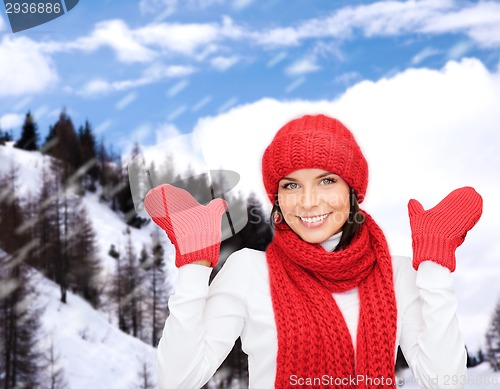 Image of smiling young woman in winter clothes