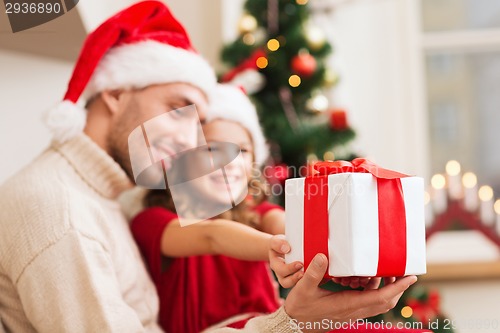 Image of close up of father and daughter with gift box
