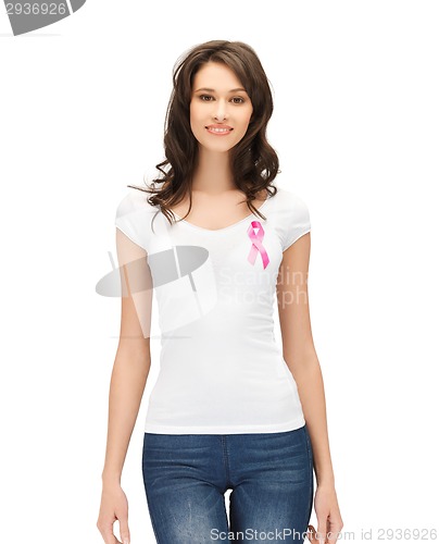 Image of smiling woman with pink cancer awareness ribbon