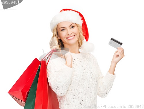 Image of woman with shopping bags and credit card