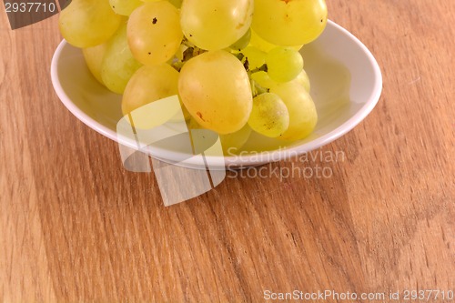 Image of A close-up of grapes on white table