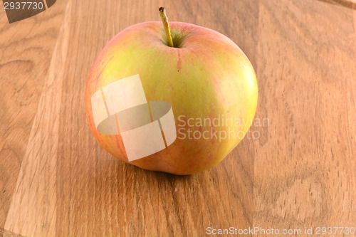 Image of food concept - apple on a wooden board