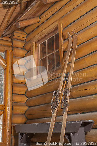 Image of vintage skis leaning against wall