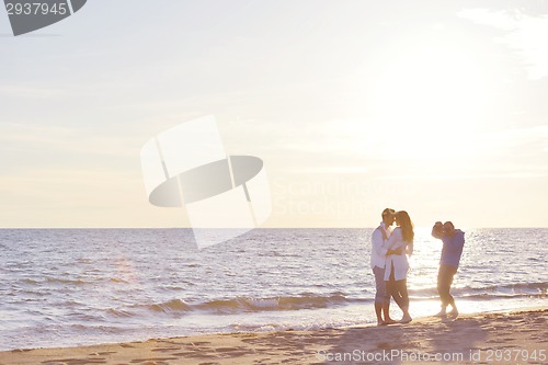 Image of photographer taking photo on beach