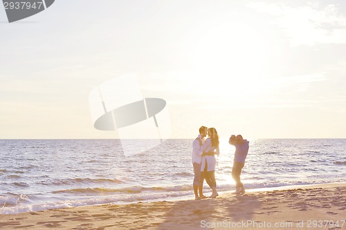 Image of photographer taking photo on beach