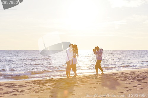 Image of photographer taking photo on beach