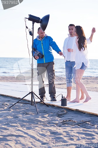 Image of photographer taking photo on beach