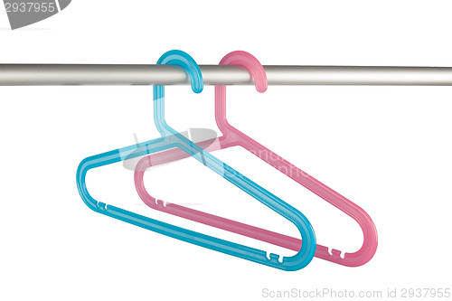 Image of Pink and blue clothes hangers