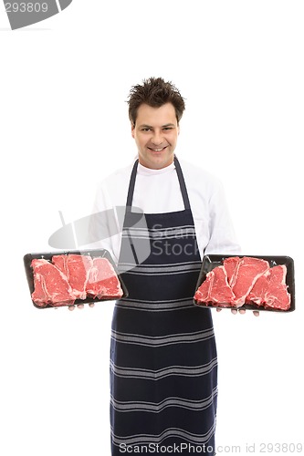 Image of Butcher with trays of T-bone steak