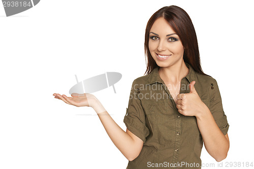 Image of Surprised young woman showing open hand palm