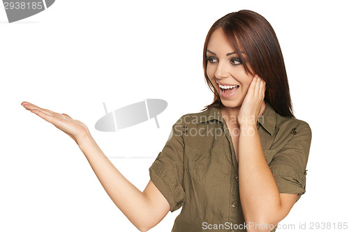 Image of Surprised young woman showing open hand palm