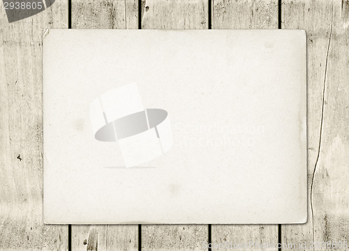 Image of Blank vintage paper sheet on a white wood board