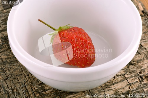 Image of Fresh ripe strawberries on a vintage wooden background