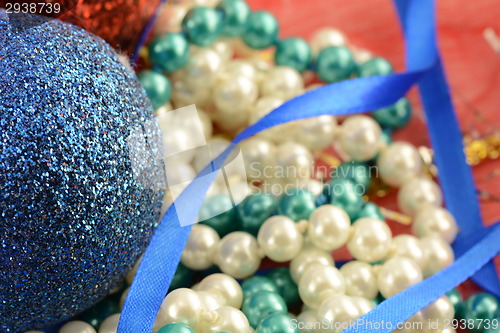 Image of Christmas background with blue and white pearls