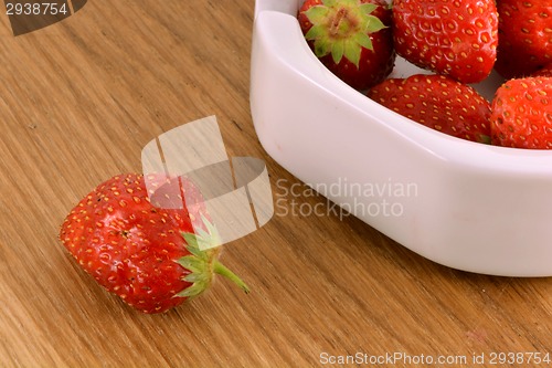 Image of Fresh ripe strawberries on a vintage wooden background