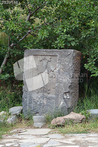 Image of Ancient stone carving with a cross 