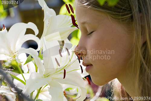 Image of girl smelling flowers