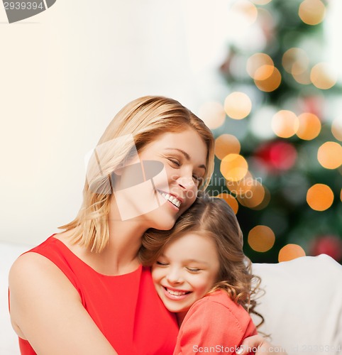 Image of hugging mother and daughter