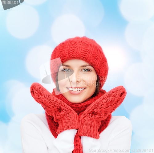 Image of smiling young woman in winter clothes