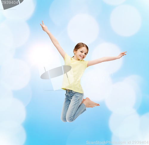 Image of smiling little girl jumping