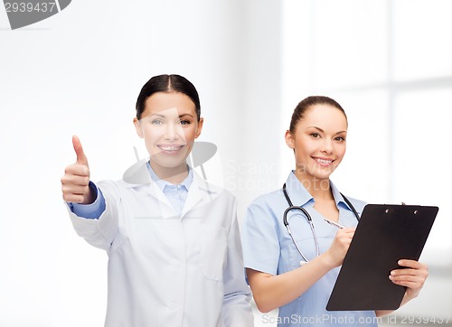 Image of smiling female doctor and nurse