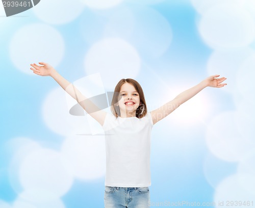 Image of smiling little girl in white blank t-shirt