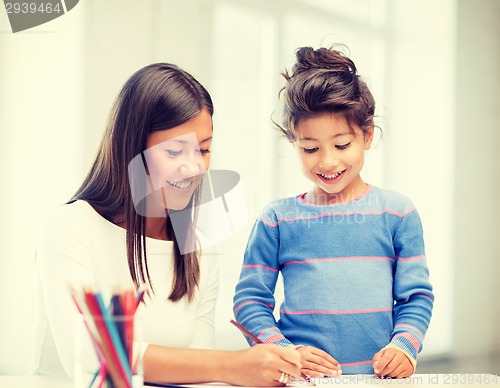 Image of mother and daughter drawing