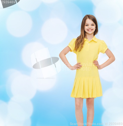 Image of smiling little girl in yellow dress