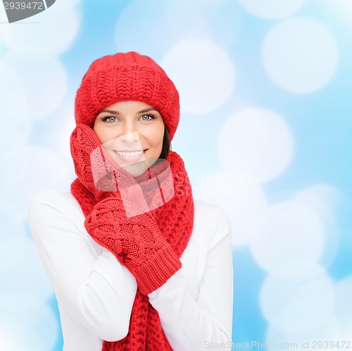 Image of smiling young woman in winter clothes