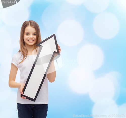 Image of smiling little girl with blank arrow pointing up