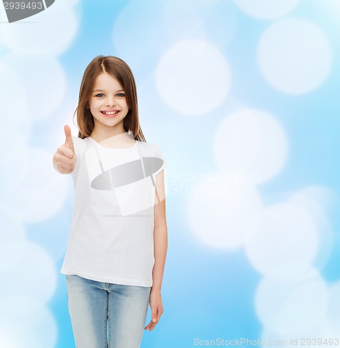 Image of smiling little girl in white blank t-shirt