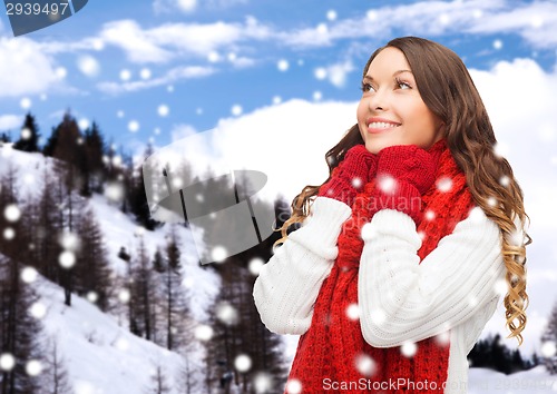 Image of smiling young woman in winter clothes