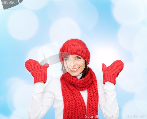 Image of smiling young woman in winter clothes